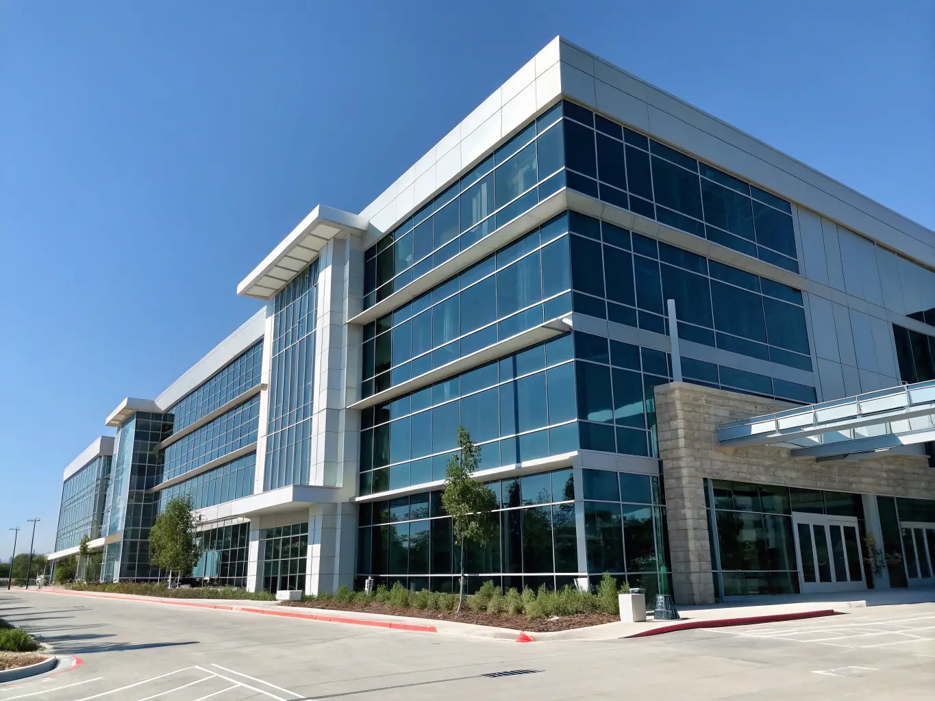 A sleek commercial office building with large glass windows and modern architecture, representing Hunter Paige Construction's commercial capabilities.