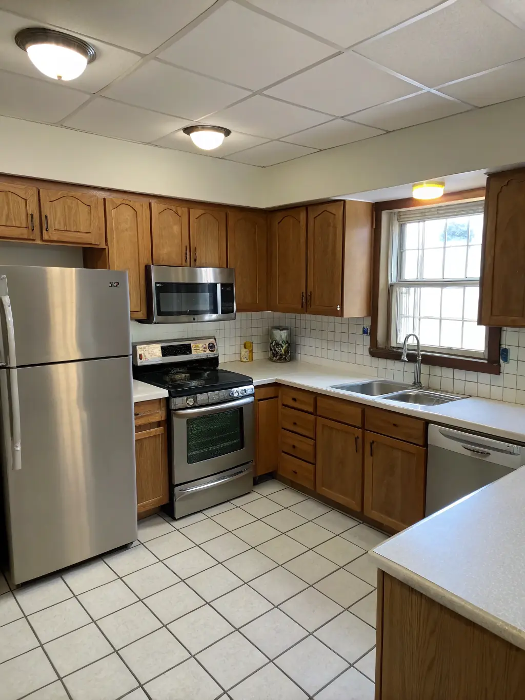 A newly constructed modern kitchen with stainless steel appliances, granite countertops, and custom cabinetry, showcasing Hunter Paige Construction's residential renovation capabilities.